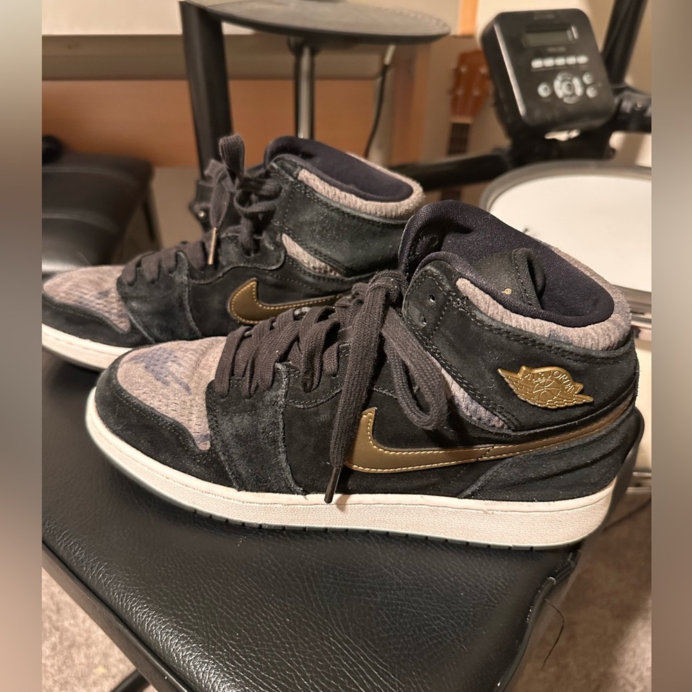 Nike black and camo Air Jordans